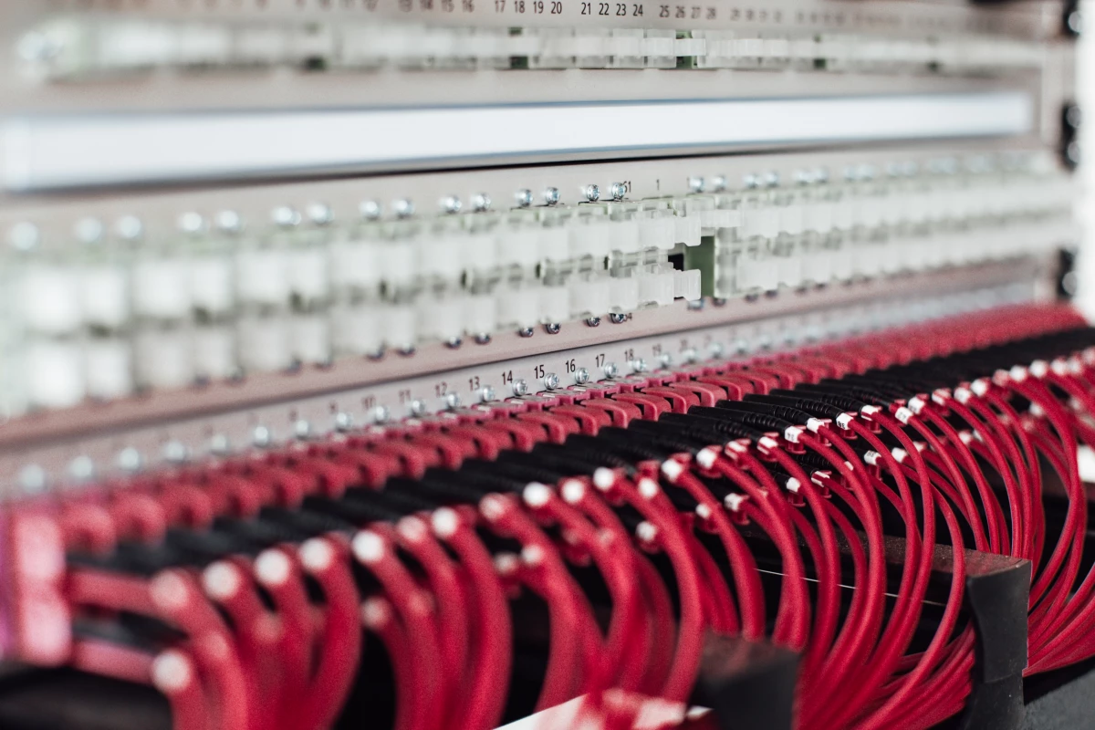 A computer board with red cables.