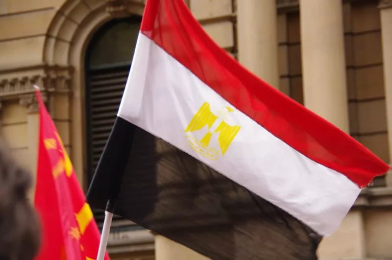 The Egyptian flag waving in the wind.