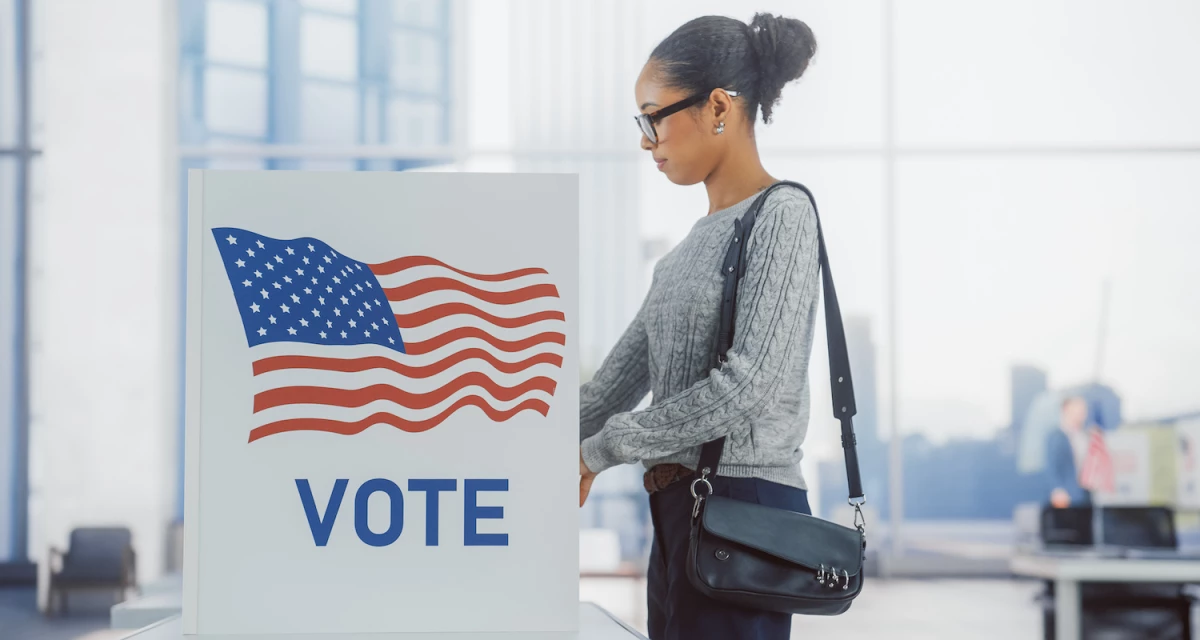 A woman at a voting booth on Election Day.